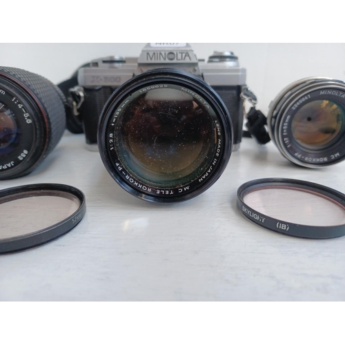 312 - Three items, one Minolta X-300 35mm SLR camera fitted with Rokkor-PF f=135mm tele-lens, one Tokina S... 