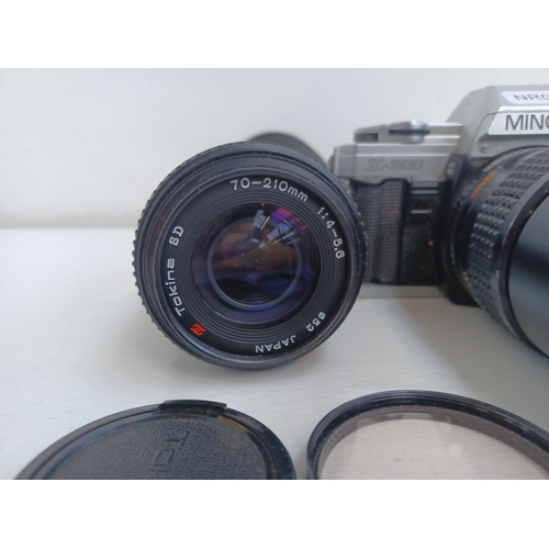 312 - Three items, one Minolta X-300 35mm SLR camera fitted with Rokkor-PF f=135mm tele-lens, one Tokina S... 