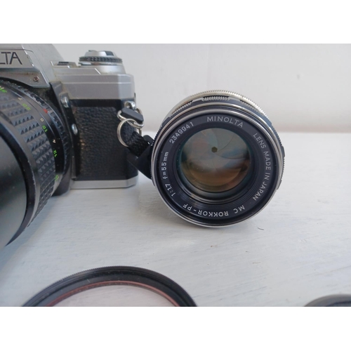 312 - Three items, one Minolta X-300 35mm SLR camera fitted with Rokkor-PF f=135mm tele-lens, one Tokina S... 