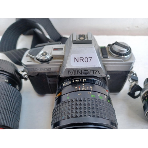 312 - Three items, one Minolta X-300 35mm SLR camera fitted with Rokkor-PF f=135mm tele-lens, one Tokina S... 