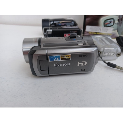 313 - A collection of digital camcorders to include boxed Sony HDR-PJ410 Handycam with accessories, cased ... 