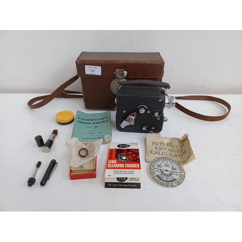 317 - A cased Pathescope Motocamera Type 'H' cine camera with accessories and instruction manual.