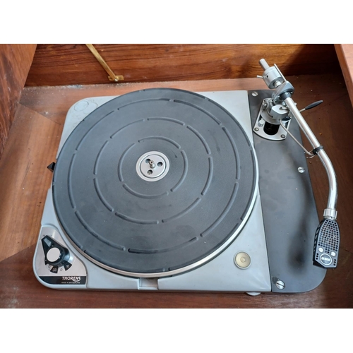 325 - A high quality Thorens TD124/II four speed belt-idler drive turntable fitted with Shure M75E cartrid... 