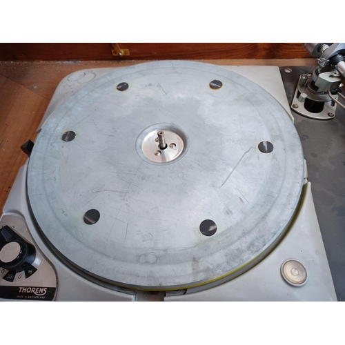 325 - A high quality Thorens TD124/II four speed belt-idler drive turntable fitted with Shure M75E cartrid... 