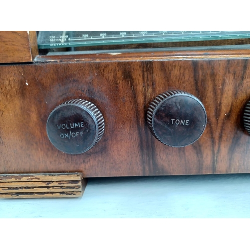 328 - A mid 20th century HMV 1121 valve radio.