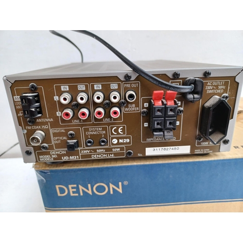 331 - A boxed Denon UD-M31 CD receiver with remote control.