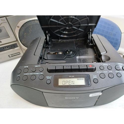 333 - Three portable stereo systems, one Hitachi TRK-8005E cassette/four band radio, one Sony CFD-S70 CD/r... 