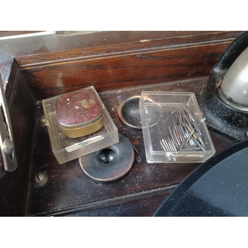 337 - A 1930's oak gramophone cabinet containing a wind-up gramophone with Goldring cartridge and a collec... 