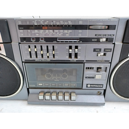 341 - An Hitachi TRK-9005E portable cassette/four band radio with detachable speakers.