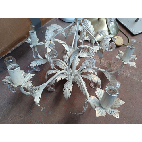 415 - A pair of white metal six branch ceiling lights with foliate design