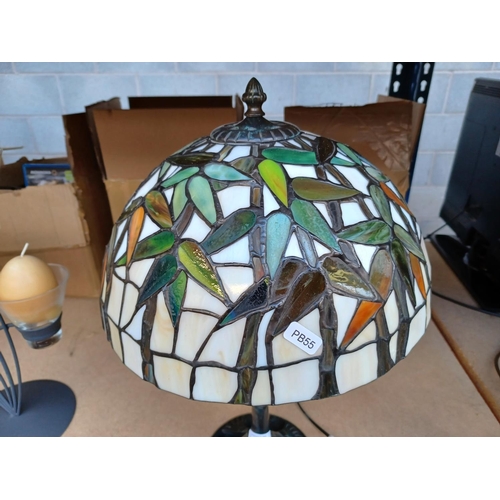 419 - A bronze effect table lamp with Tiffany style shade