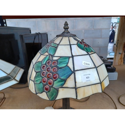 423 - A bronze effect table lamp with Tiffany style shade