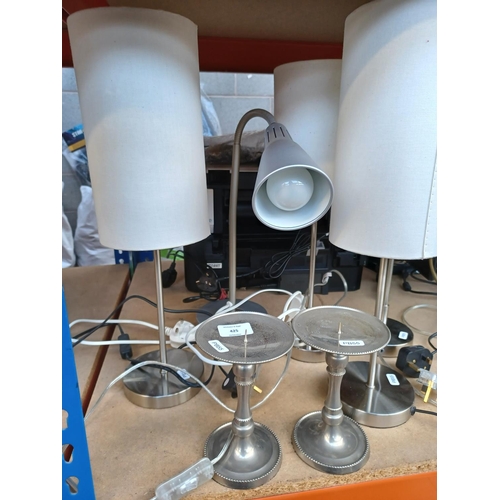 425 - A collection of lighting items to include brushed metal table lamps, goose neck reading light, chrom... 