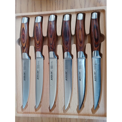 437 - Two items, one Anolon Brunello Collection six piece steak knife set with covered beech wood presenta... 