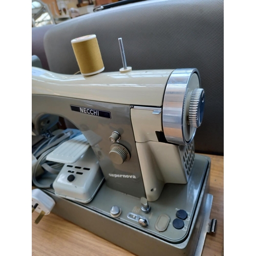 476 - A cased Necchi Supernova electric sewing machine