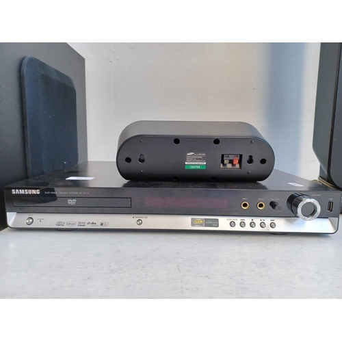 351 - A Samsung HT-TX25 DVD home cinema system comprising DVD player, centre speaker, subwoofer, pair of f... 