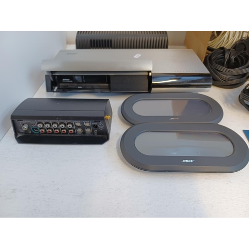 354 - A Bose Lifestyle 40 music system comprising powered Acoustimass 30 Series II speaker system, four cu... 