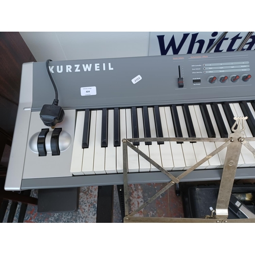 404 - A Kurzweil SP2X stage piano with stand, Shure P58 microphone and stand, foot pedal, power adaptor, m... 