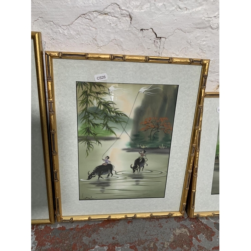 300 - Four framed Oriental paintings on cloth - largest approx. 42cm high x 32cm wide