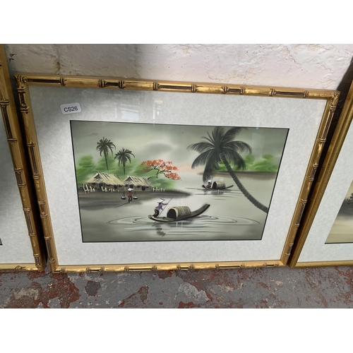 300 - Four framed Oriental paintings on cloth - largest approx. 42cm high x 32cm wide