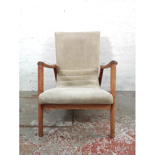 10 - A mid 20th century G Plan beech and beige upholstered armchair - approx. 85cm high x 64cm wide x 73c... 