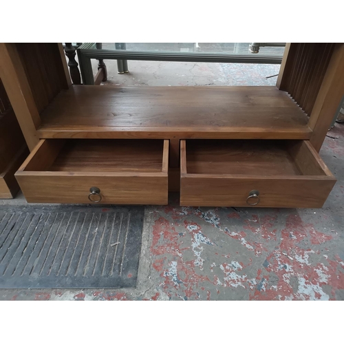 116 - An Indonesian solid teak five tier free standing bookcase with two lower drawers - approx. 191cm hig... 