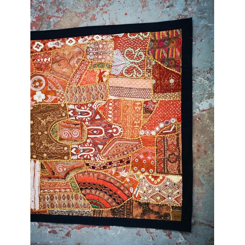 121 - An Indian style embroidered wall hanging with sequins and beads - approx. 156cm x 106cm