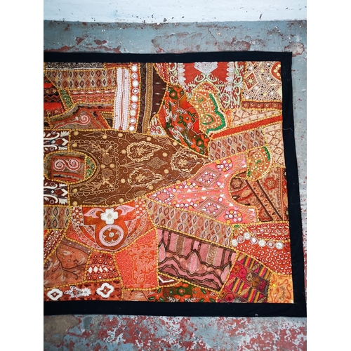 121 - An Indian style embroidered wall hanging with sequins and beads - approx. 156cm x 106cm