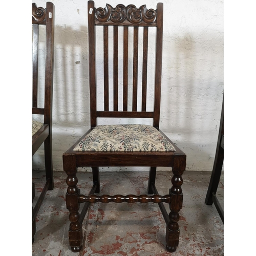 123 - A set of four carved oak dining chairs with barley twist supports