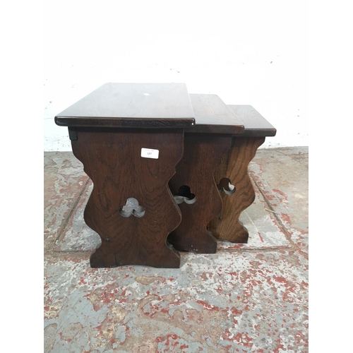 127 - A cottage style oak nest of three tables - approx. 43cm high x 50cm wide x 28cm deep