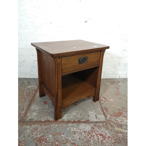 130 - An Arts & Crafts style oak side table with single drawer - approx. 60cm high x 57cm wide x 44cm deep