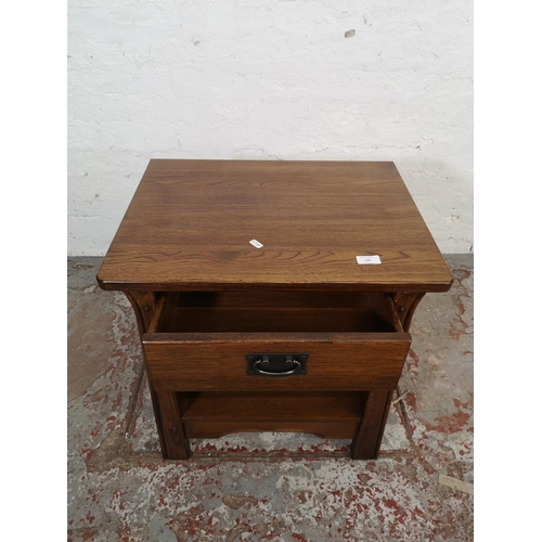 130 - An Arts & Crafts style oak side table with single drawer - approx. 60cm high x 57cm wide x 44cm deep