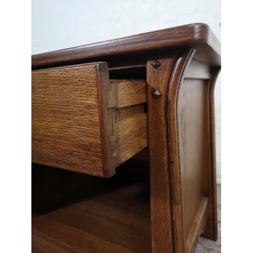 130 - An Arts & Crafts style oak side table with single drawer - approx. 60cm high x 57cm wide x 44cm deep