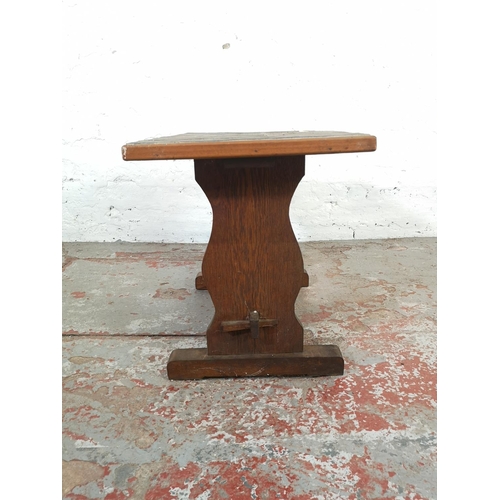 134 - A mid 20th century oak and tile top rectangular side table - approx. 49cm high x 39cm wide x 70cm lo... 