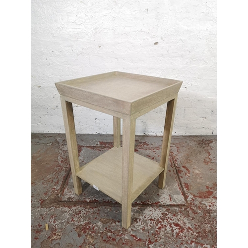 147 - A contemporary grey finish two tier square side table - approx. 66cm high x 43cm square