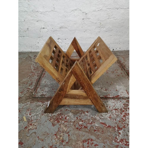 151 - An Indian sheesham wood magazine rack - approx. 32cm high x 43cm wide x 37cm deep