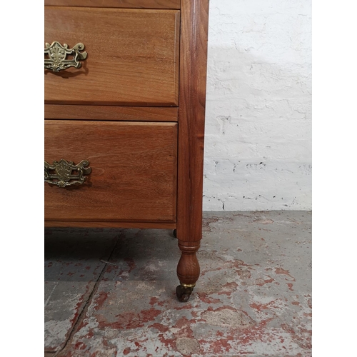 155A - An Edwardian satinwood chest of two short over two long drawers with castors - approx. 80cm high x 1... 