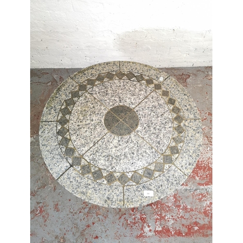 160 - A contemporary marble and black painted wrought iron circular patio table - approx. 73cm high x 77cm... 