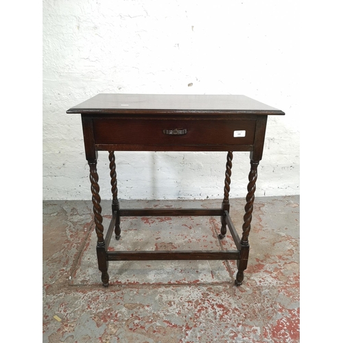 163 - A mid 20th century oak rectangular side table with barley twist supports and later added castors - a... 