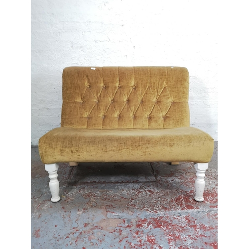 173 - A modern yellow button back upholstered and white painted two seater sofa - approx. 90cm high x 115c... 