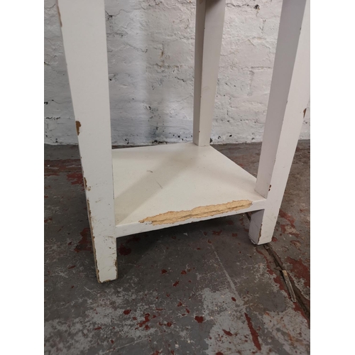 193 - A modern white painted and hardwood two tier side table with single drawer - approx. 79cm high x 39c... 