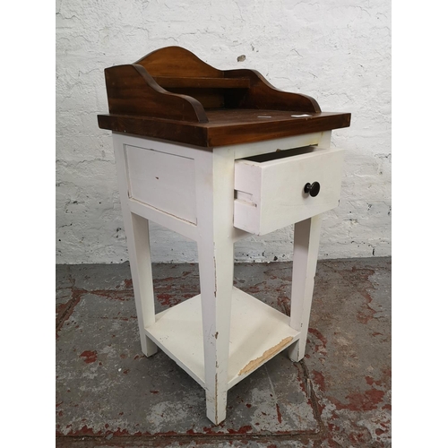 193 - A modern white painted and hardwood two tier side table with single drawer - approx. 79cm high x 39c... 