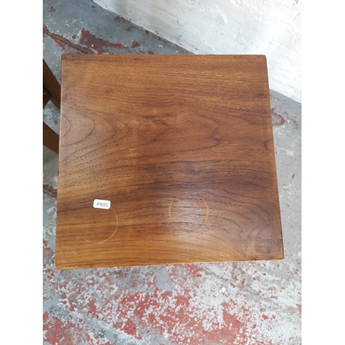 195 - Two Indonesian solid teak side tables, largest approx. 76cm high x 35cm square