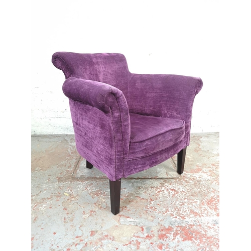 196 - A modern purple upholstered armchair - approx. 80cm high x 69cm wide x 62cm deep