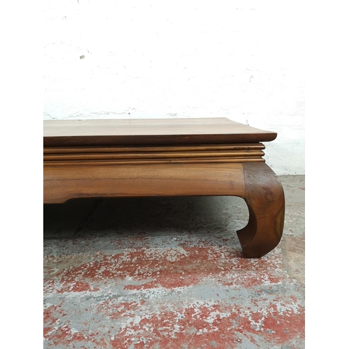 197 - An Indonesian solid teak low rectangular coffee table - approx. 42cm high x 88cm wide x 180cm long