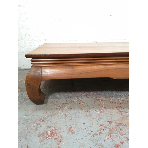 197 - An Indonesian solid teak low rectangular coffee table - approx. 42cm high x 88cm wide x 180cm long