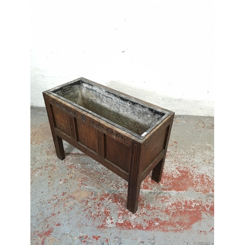 200 - A 19th century carved oak three panel coffer converted garden planter with galvanised metal interior... 