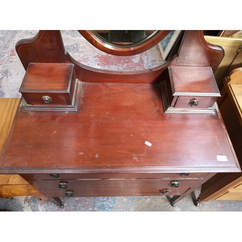 204 - An Edwardian inlaid mahogany dressing chest with three long drawers, two trinket drawers and upper o... 