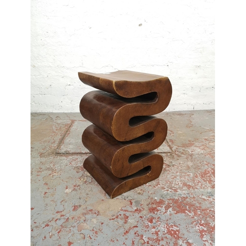 206 - A contemporary carved hardwood snake design side table - approx. 51cm high x 30cm wide x 29.5cm deep