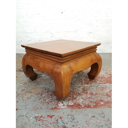 207 - An Indonesian solid teak low square coffee table - approx. 42cm high x 60cm square